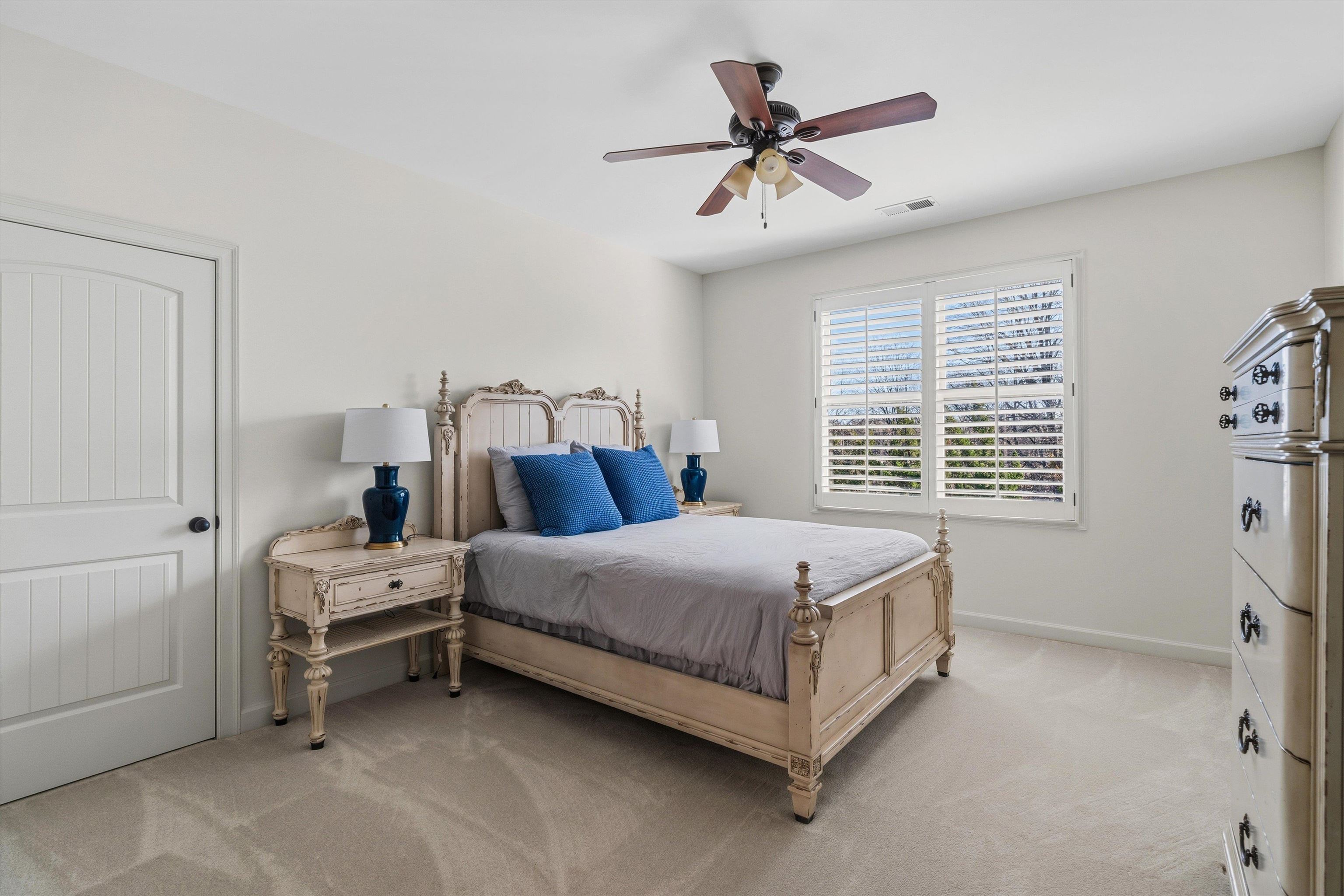 639 Critz Cove Collierville, TN 38017 - Photo 31 of 40 a bed room with a bed and a ceiling fan