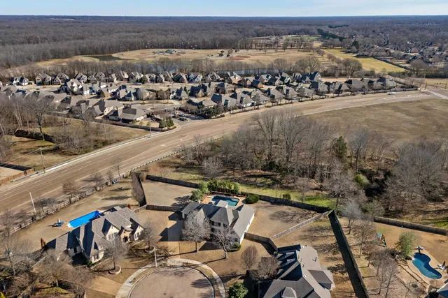 an aerial view of a house with a yard lake view and mountain view