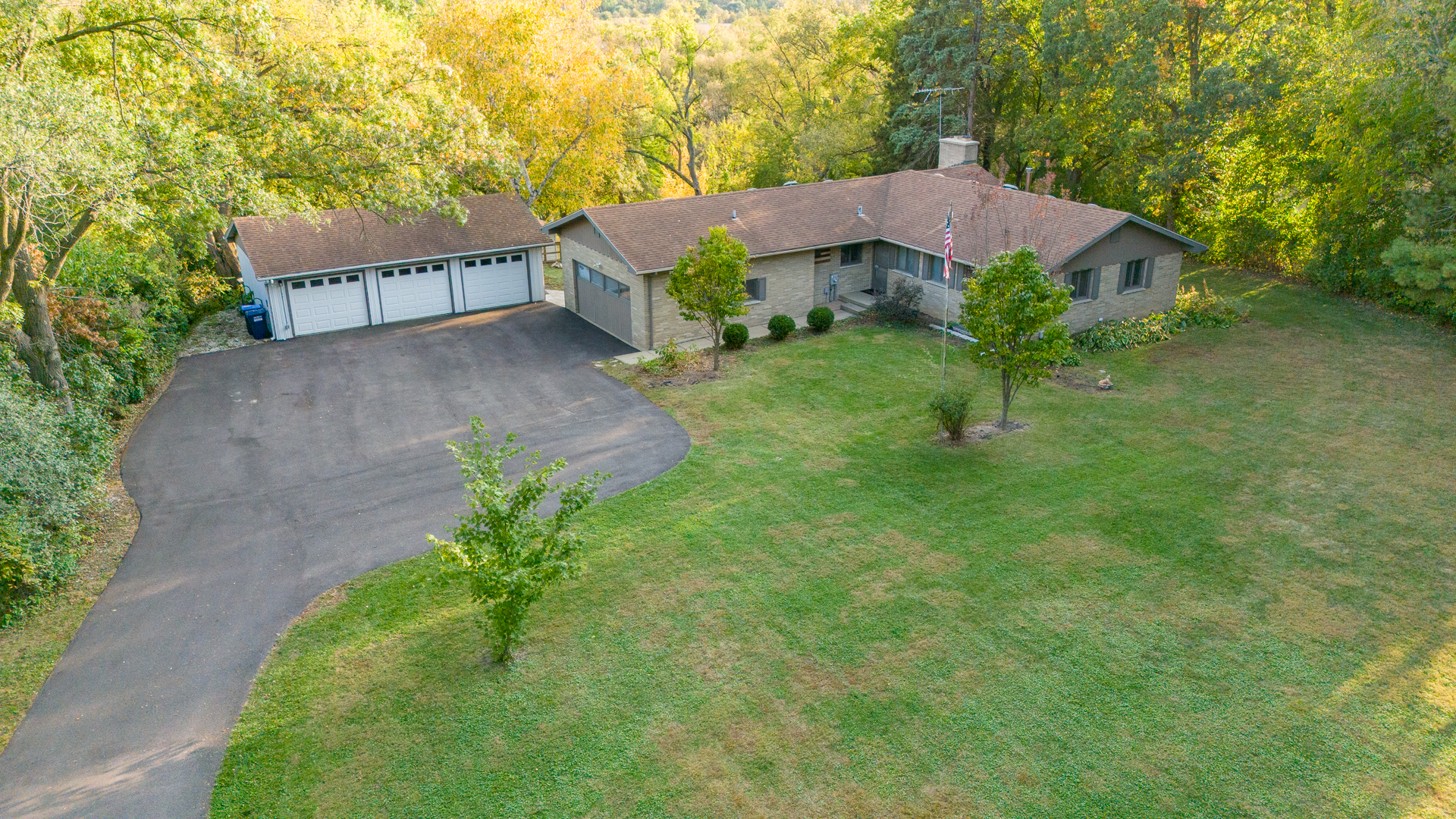41-w331 Empire Road St. Charles, IL 60175 - Photo 1 of 25 a view of a house with a yard and a large tree