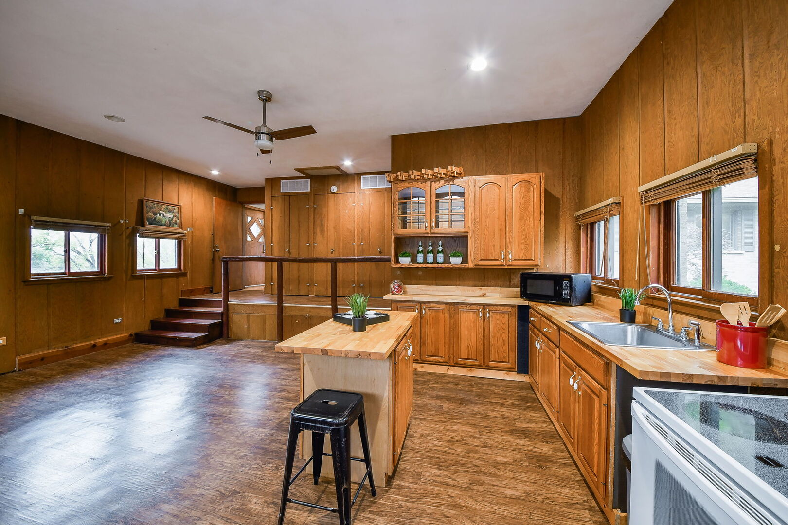 41-w331 Empire Road St. Charles, IL 60175 - Photo 12 of 25 a large kitchen with lots of counter space a sink a window and stainless steel appliances