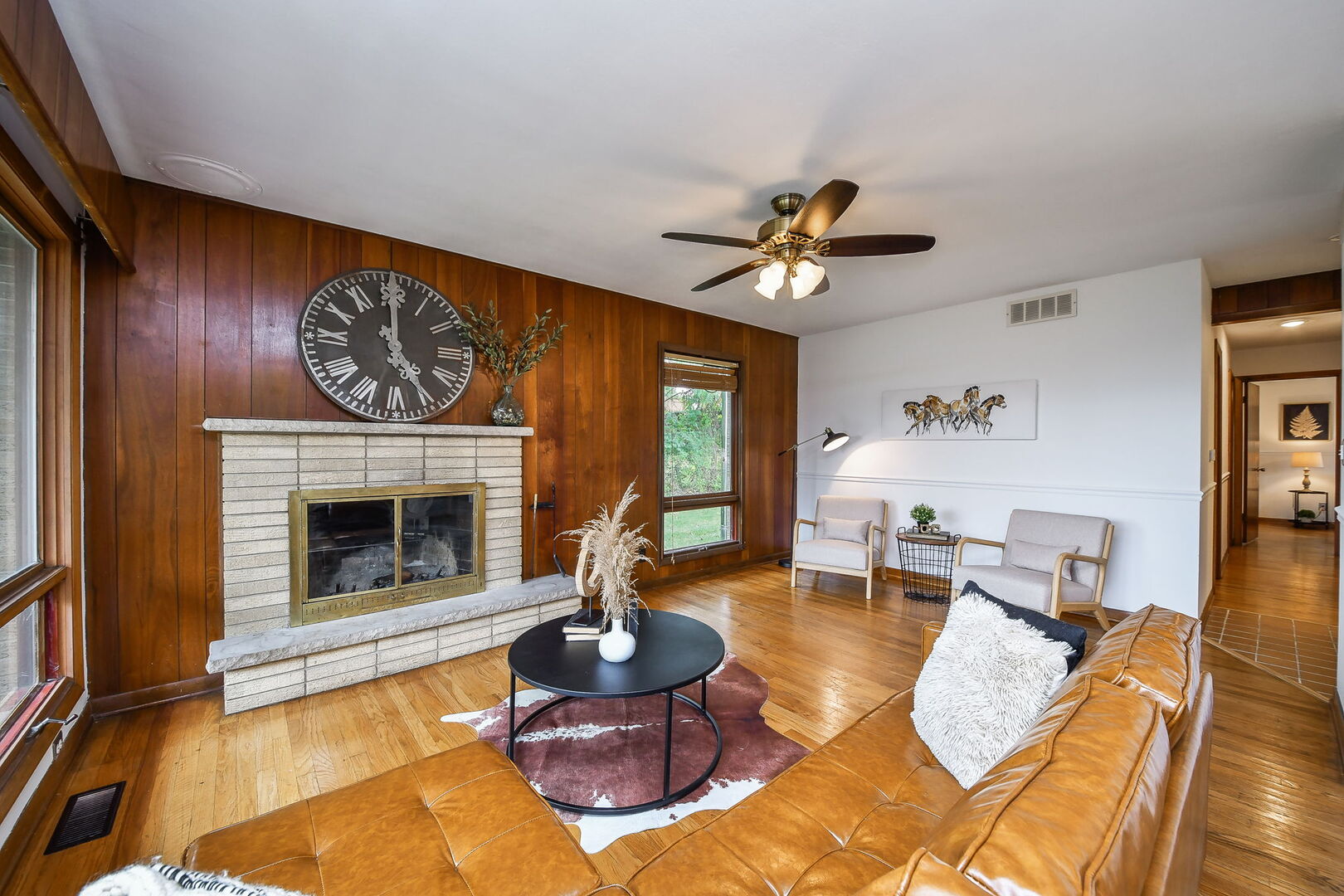 41-w331 Empire Road St. Charles, IL 60175 - Photo 7 of 25 a living room with furniture a fireplace and a large window