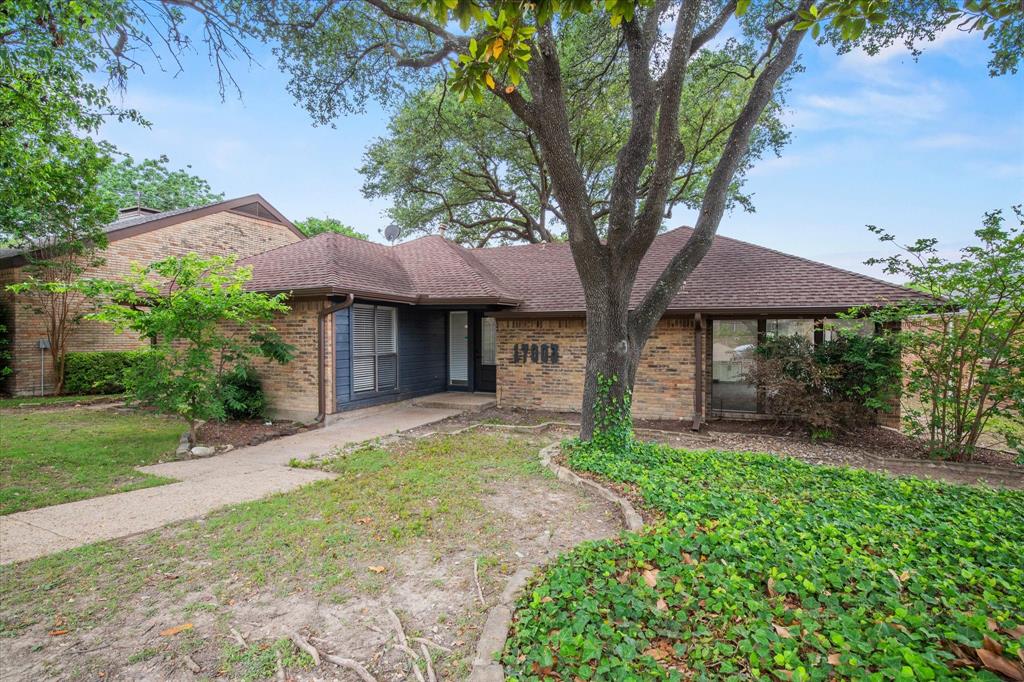 17003 Davenport Road Dallas, TX 75248 - Photo 3 of 40 a front view of a house with garden