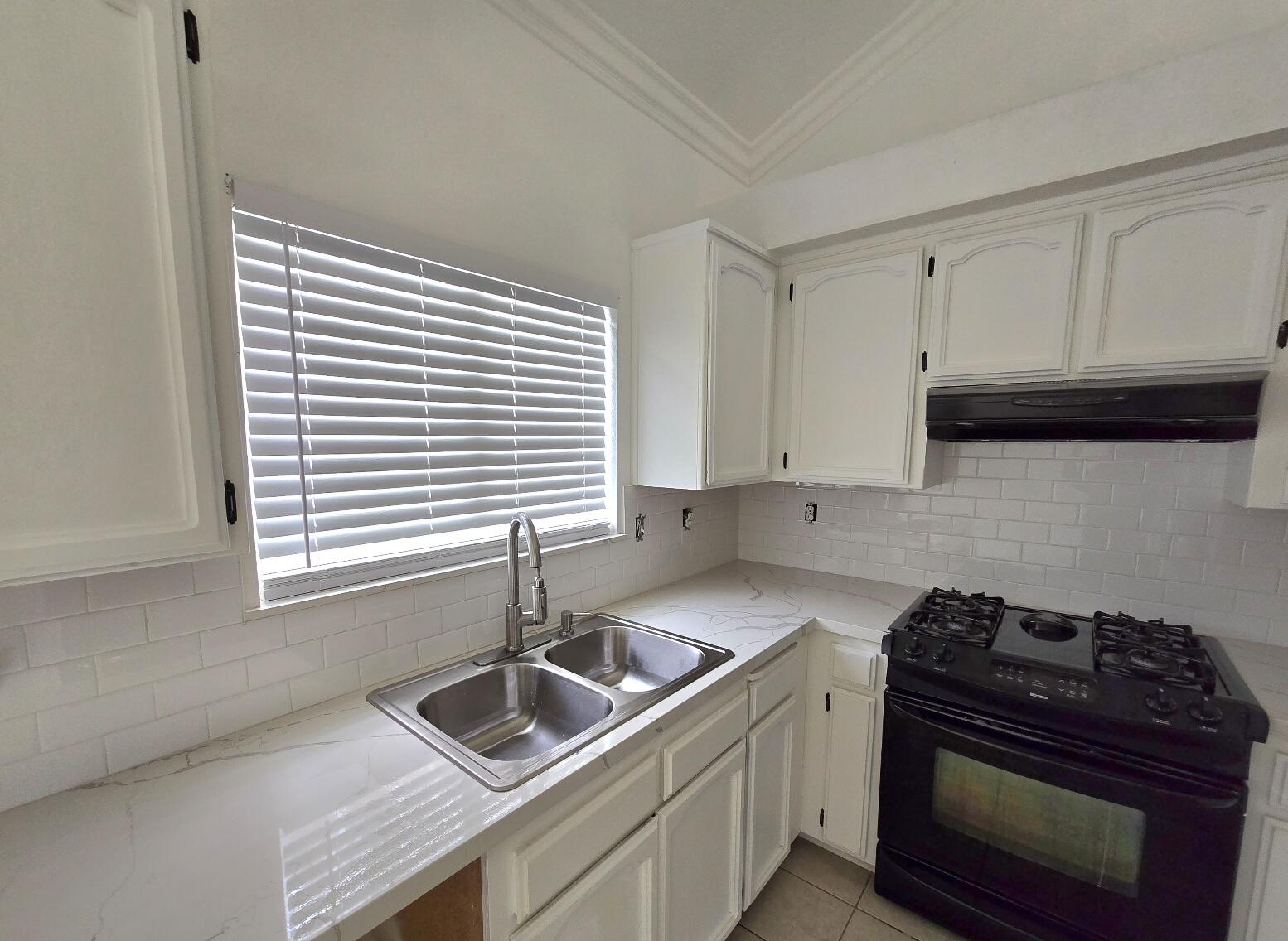454 Alamine Drive Redding, CA 96003 - Photo 12 of 28 a kitchen that has a sink and a stove
