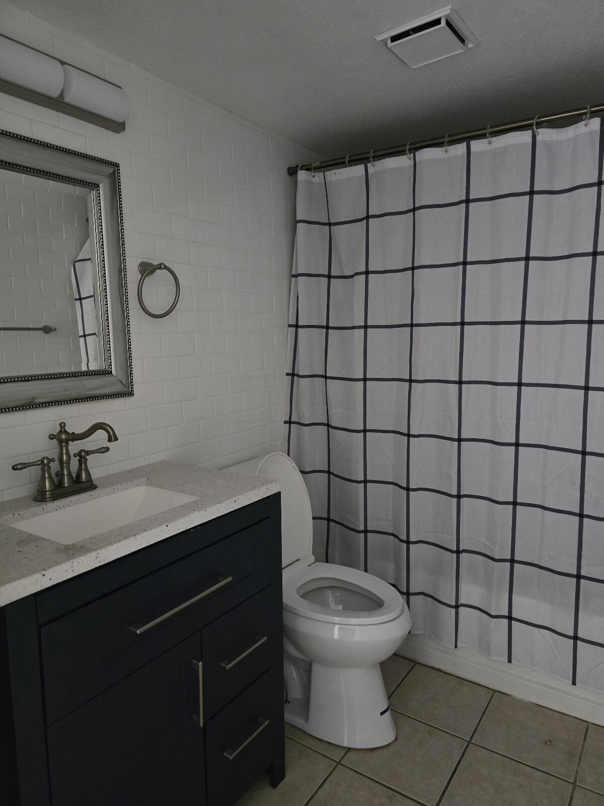 454 Alamine Drive Redding, CA 96003 - Photo 17 of 28 a bathroom with a toilet sink and mirror