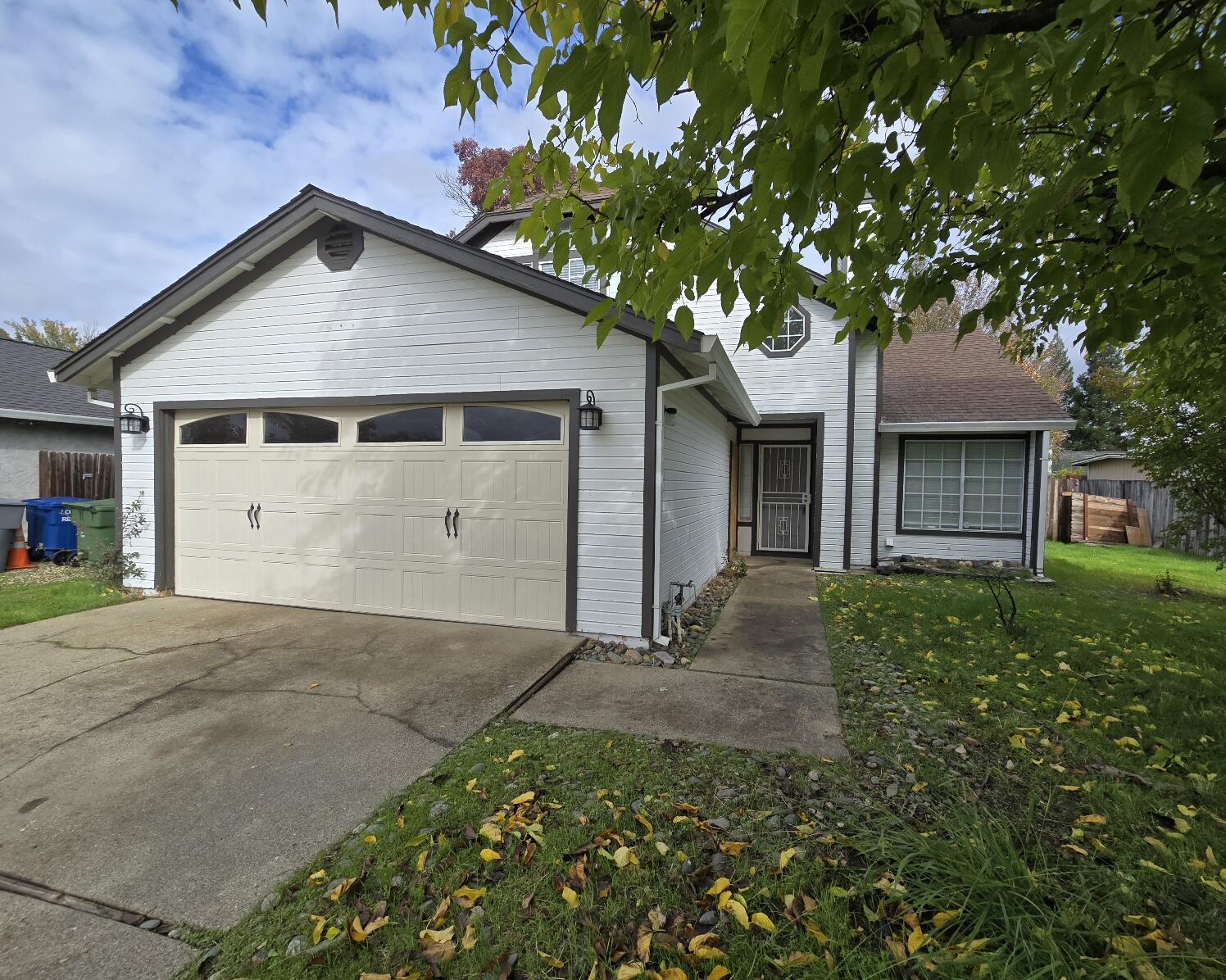 454 Alamine Drive Redding, CA 96003 - Photo 2 of 28 a view of a house with a tree in front of it