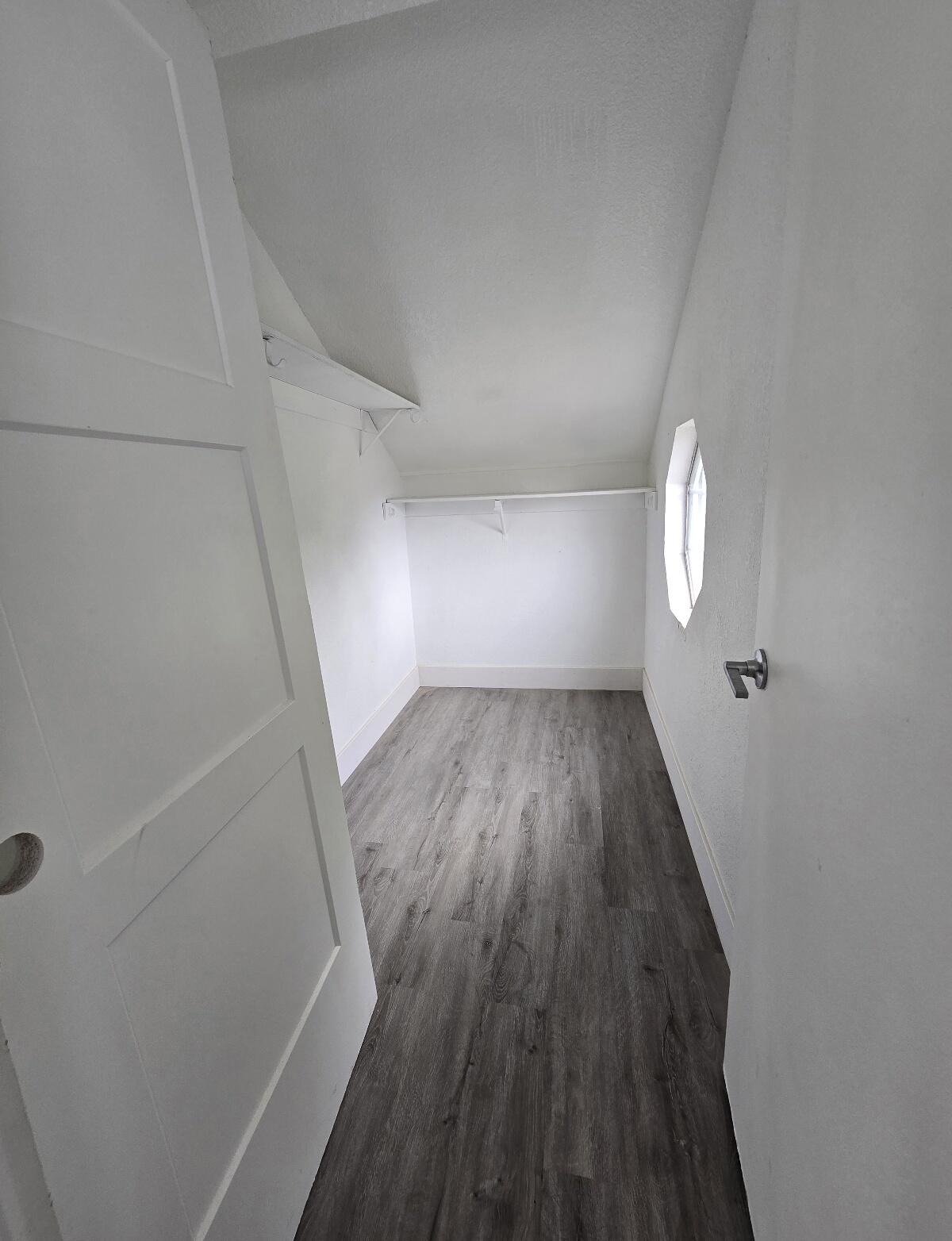 454 Alamine Drive Redding, CA 96003 - Photo 21 of 28 wooden floor in an empty room with a window