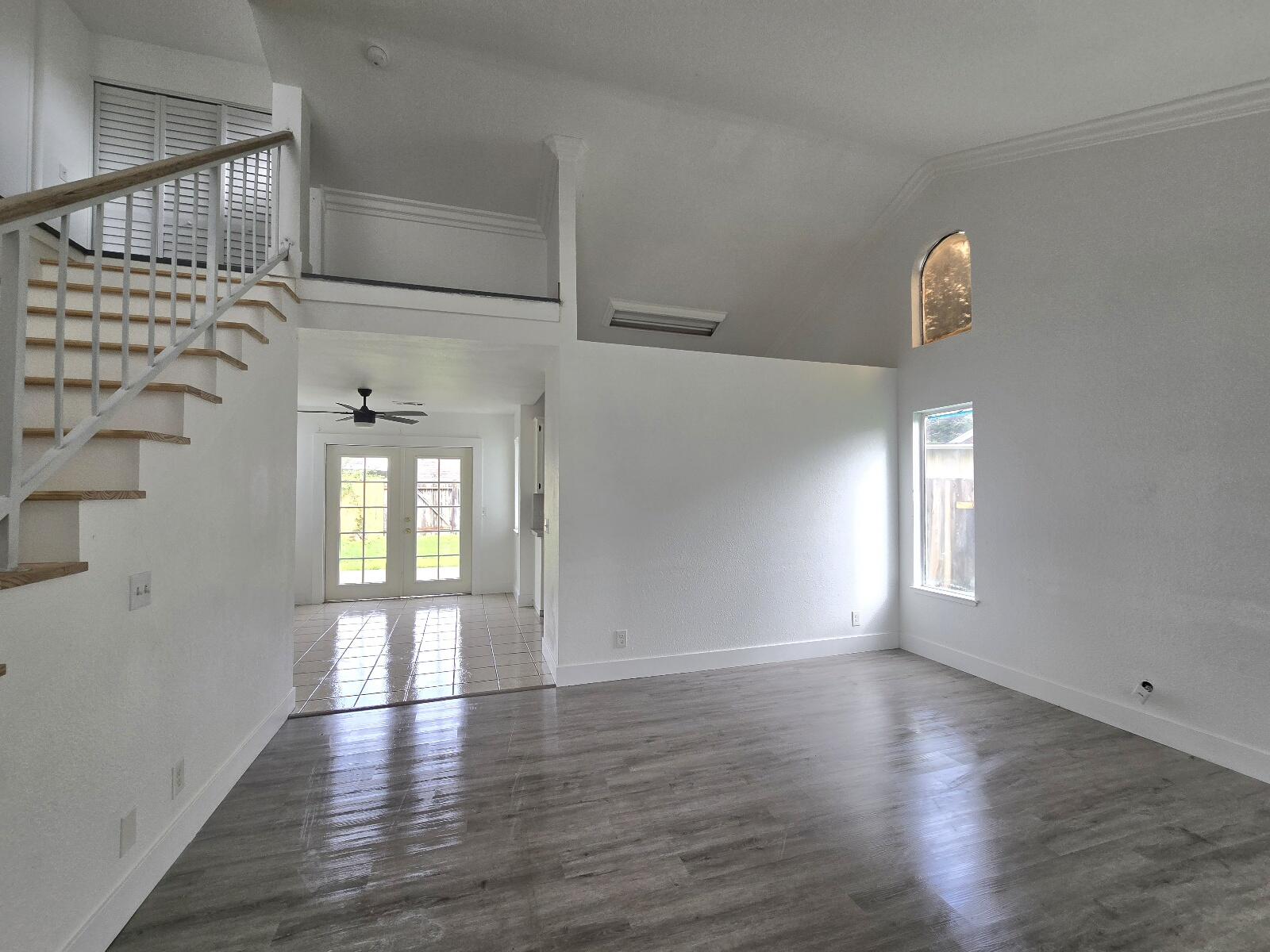 454 Alamine Drive Redding, CA 96003 - Photo 5 of 28 a view of an empty room with wooden floor and a window