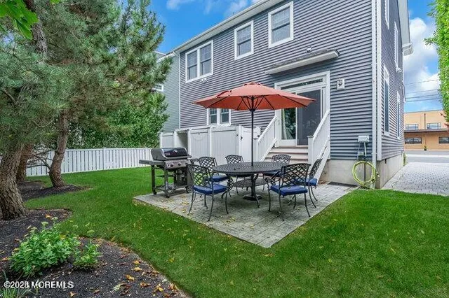 a view of a backyard with furniture and a slide