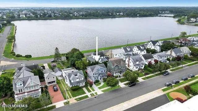 an aerial view of a house with a lake view
