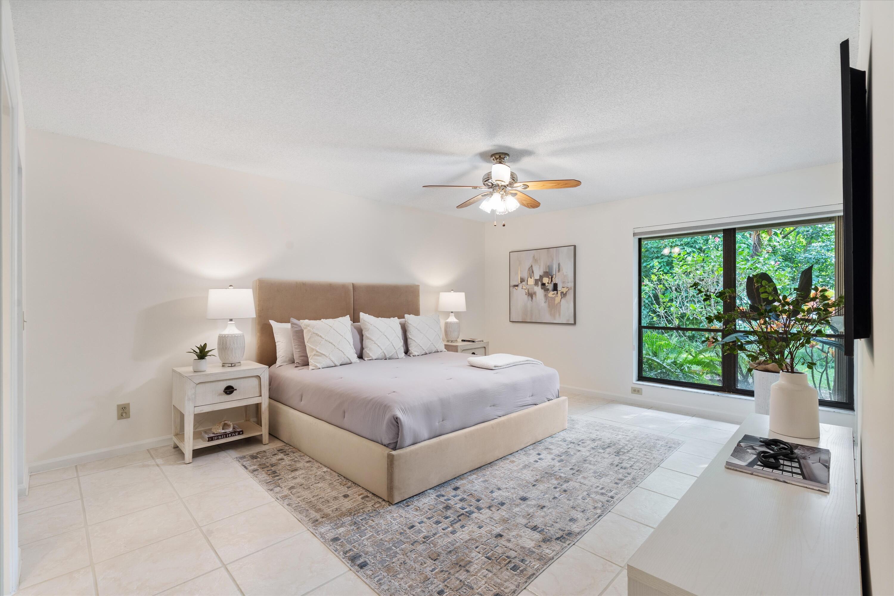 5620 Coach House Circle, Unit D Boca Raton, FL 33486 - Photo 12 of 27 Primary Bedroom