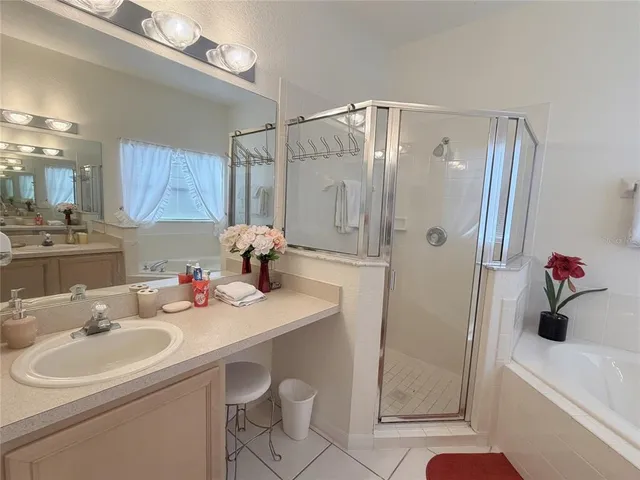 a bed room with a bed and a chair