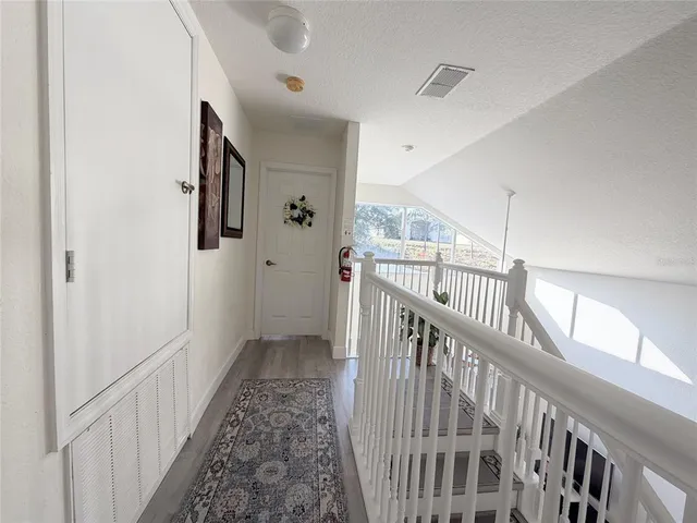 a view of a hallway with a white walls