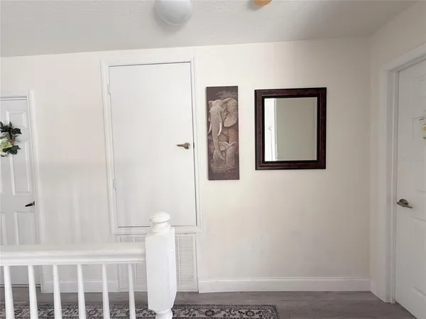 a view of a room with table and chairs