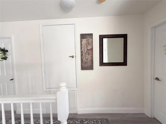 a view of a room with table and chairs