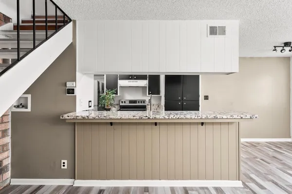a kitchen with a sink and cabinets