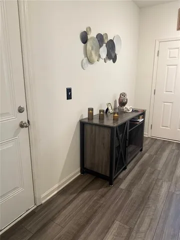 a view of a room with wooden floor
