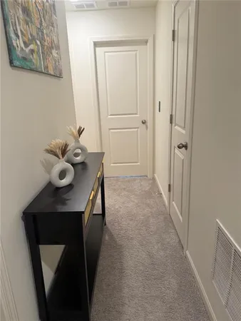 a view of entryway with livingroom