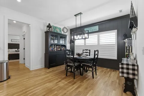 a view of a dining room with furniture and window