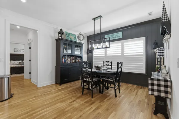 a view of a dining room with furniture and window