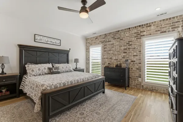 a bedroom with a bed and a fireplace