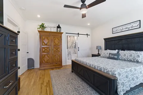 a bedroom with a bed and a walk in closet