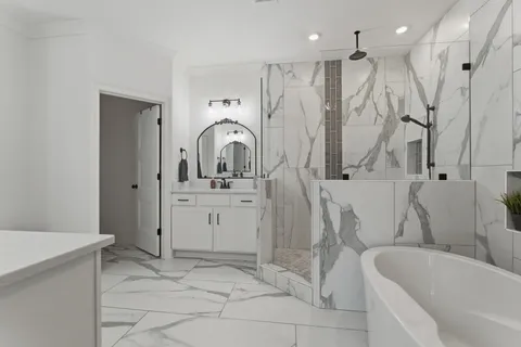 a bathroom with a sink a toilet and a bathtub