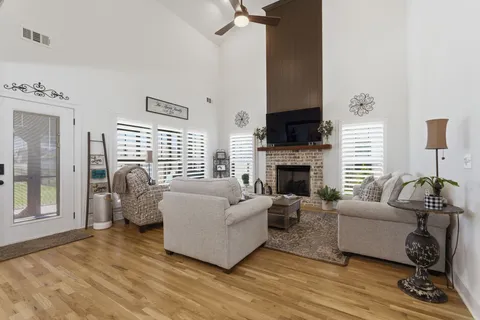 a living room with furniture and a fireplace