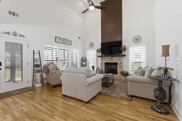 a living room with furniture and a fireplace