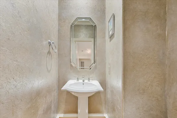 a bathroom with a sink and mirror