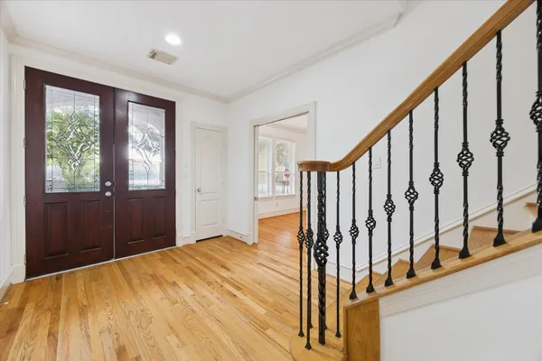 a view of an entryway with wooden floor