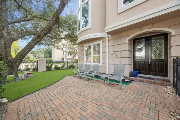 a backyard of a house with outdoor seating