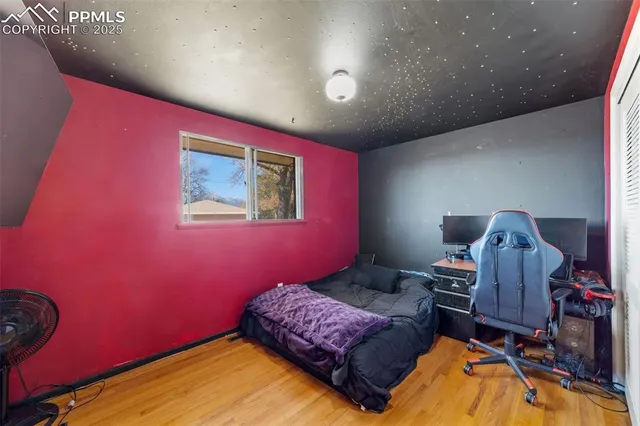 a bedroom with a bed and furniture