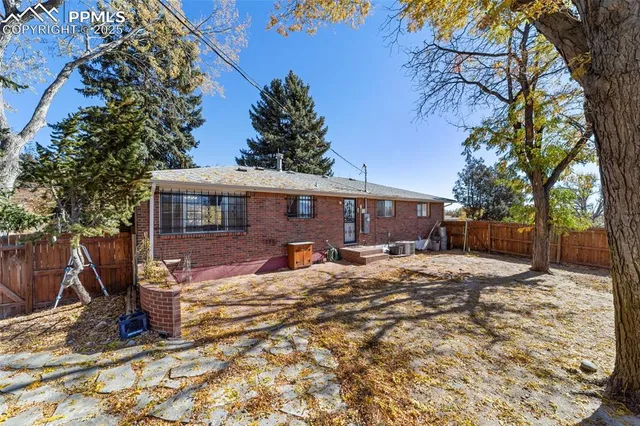 a view of a house with a yard covered in snow