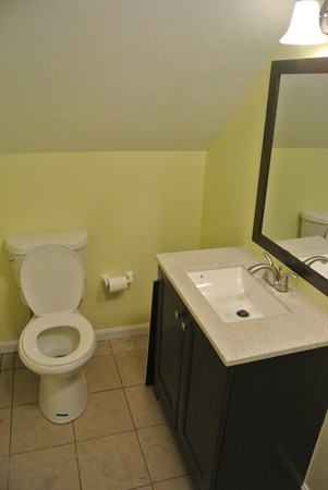 208 Whittenton Street Taunton, MA 02780 - Photo 11 of 15 a bathroom with a sink and a toilet