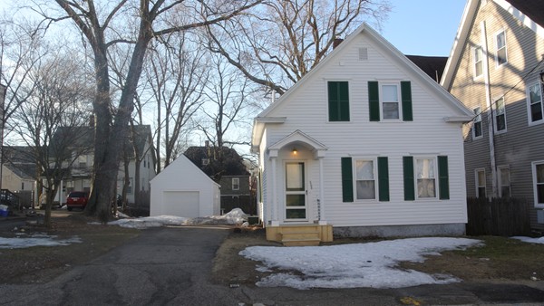 208 Whittenton Street Taunton, MA 02780 - Photo 2 of 15 a view of a white house with a large tree