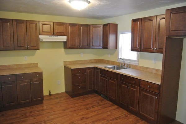 208 Whittenton Street Taunton, MA 02780 - Photo 3 of 15 a kitchen with a sink and cabinets