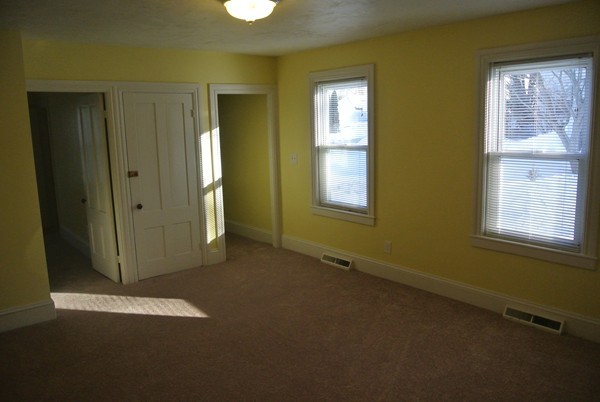 208 Whittenton Street Taunton, MA 02780 - Photo 6 of 15 a view of an empty room with a window