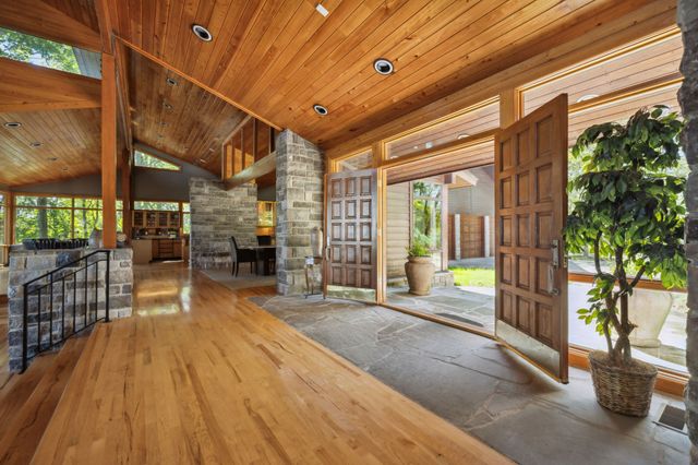 a swimming pool with outdoor seating and yard