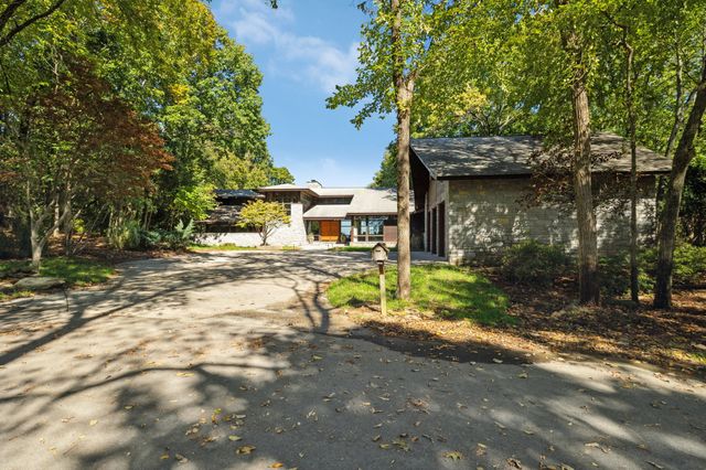a view of a house with a street