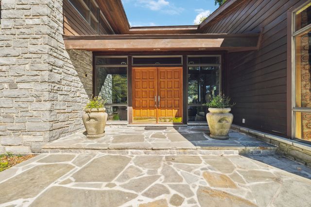 a view of a door of the house with an outdoor space