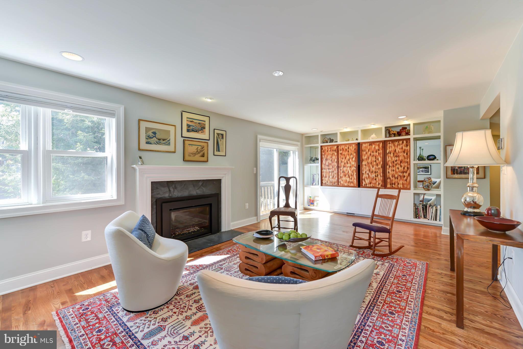 2126 Military Road Arlington, VA 22207 - Photo 7 of 29 a living room with furniture a fireplace and a large window