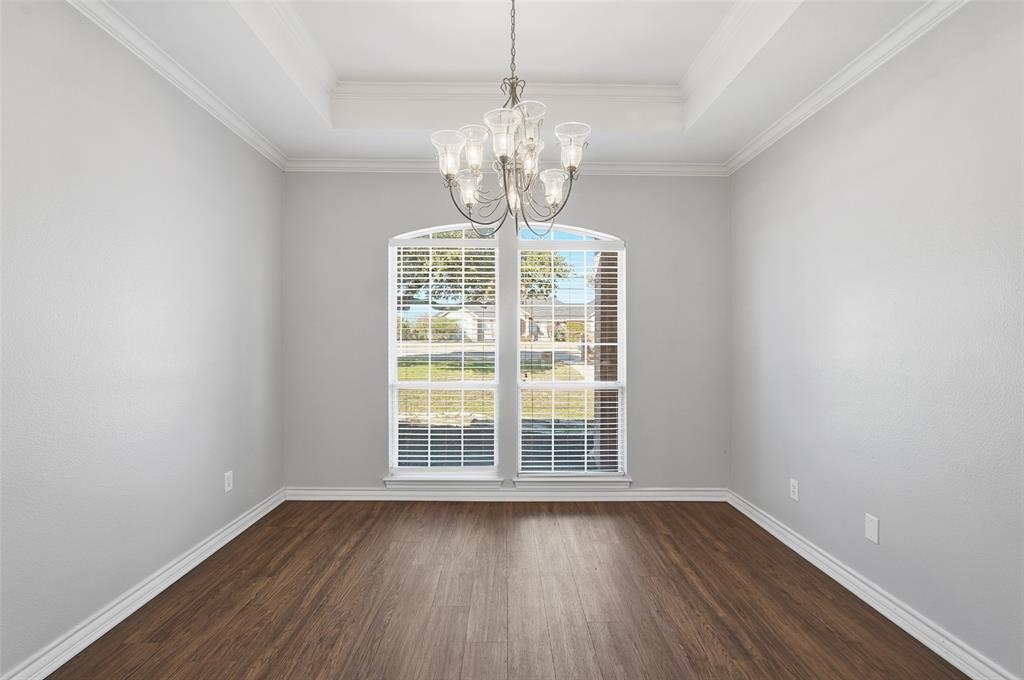 135 Rim Rock Road Aledo, TX 76008 - Photo 14 of 40 a view of wooden floor and windows in a room