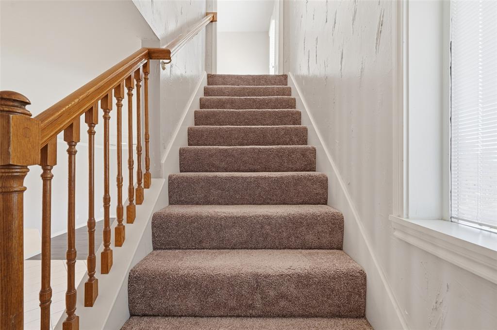 135 Rim Rock Road Aledo, TX 76008 - Photo 16 of 40 a living room with furniture and stairs