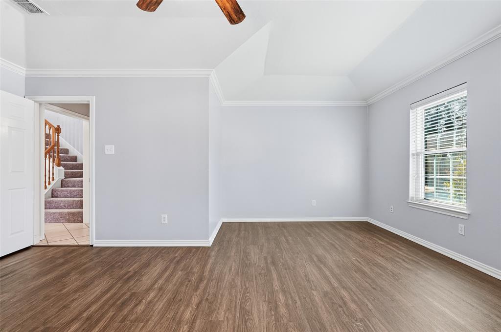 135 Rim Rock Road Aledo, TX 76008 - Photo 19 of 40 wooden floor in an empty room with a window