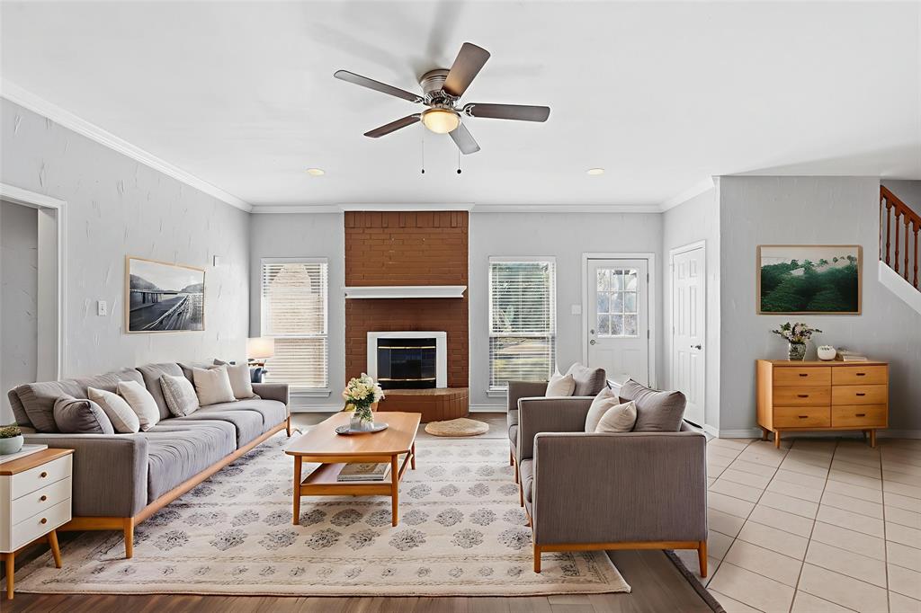 135 Rim Rock Road Aledo, TX 76008 - Photo 2 of 40 a living room with furniture and a fireplace