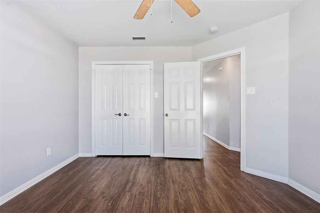 135 Rim Rock Road Aledo, TX 76008 - Photo 23 of 40 a view of an empty room with wooden floor