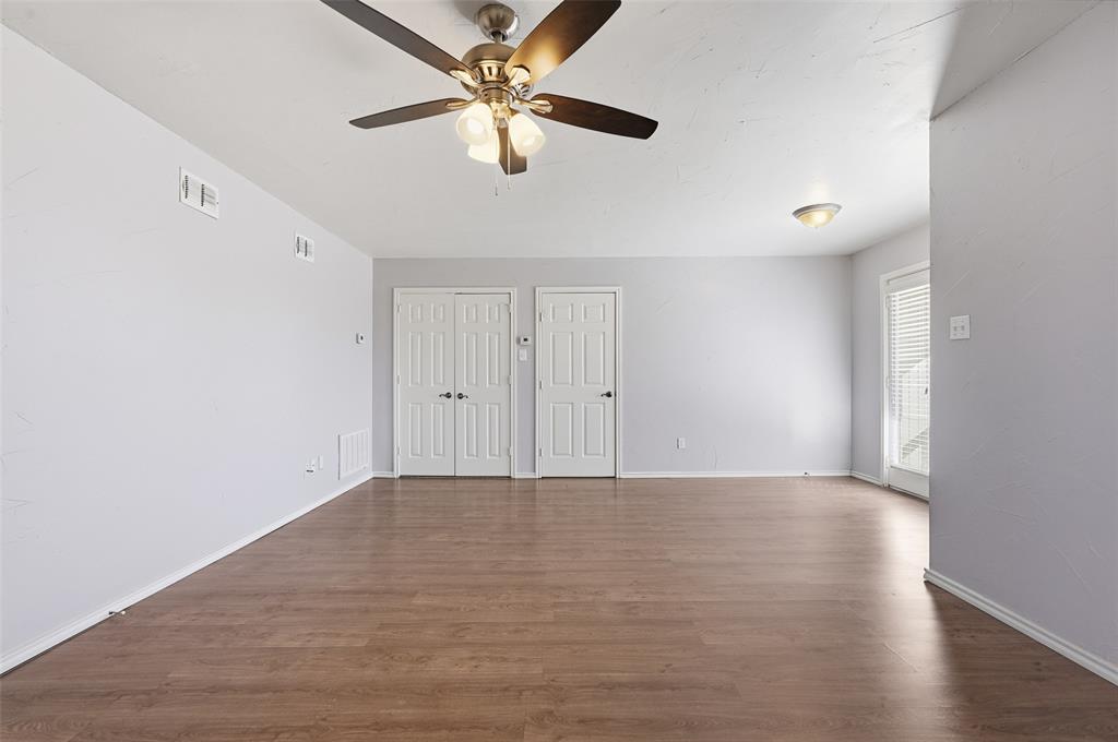 135 Rim Rock Road Aledo, TX 76008 - Photo 27 of 40 a view of an empty room with wooden floor