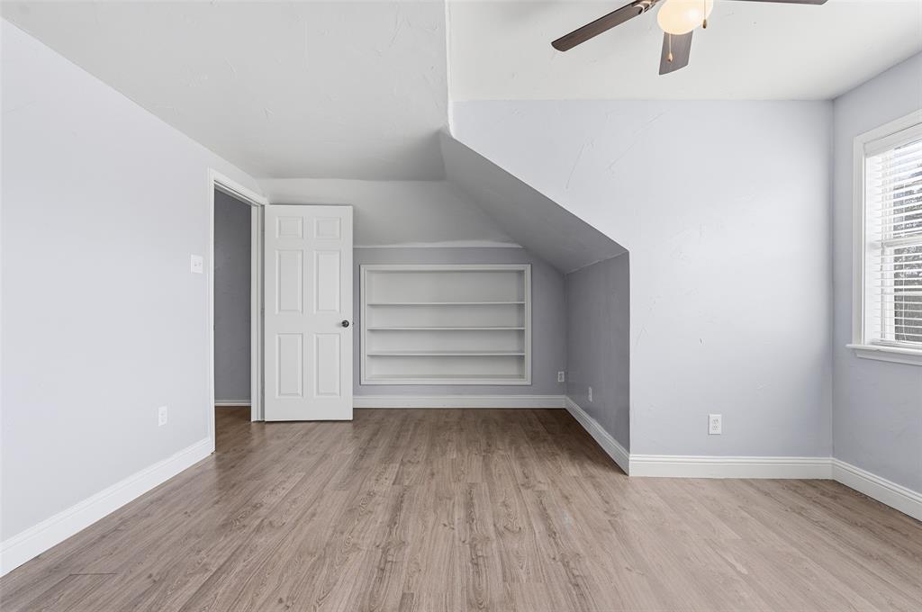 135 Rim Rock Road Aledo, TX 76008 - Photo 29 of 40 wooden floor in an empty room with a window