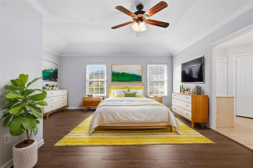 135 Rim Rock Road Aledo, TX 76008 - Photo 4 of 40 a bedroom with a bed and a chandelier