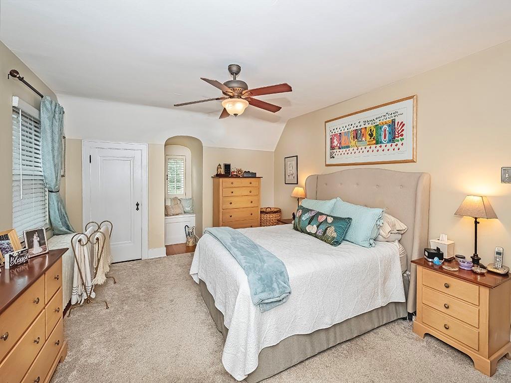 644 Beverly Road Pittsburgh, PA 15243 - Photo 13 of 26 a spacious bedroom with a bed a chandelier and a dresser